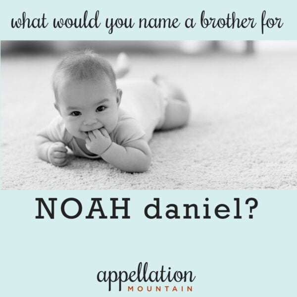 baby boy chewing on fingers lying on belly on carpet; naming a brother for Noah