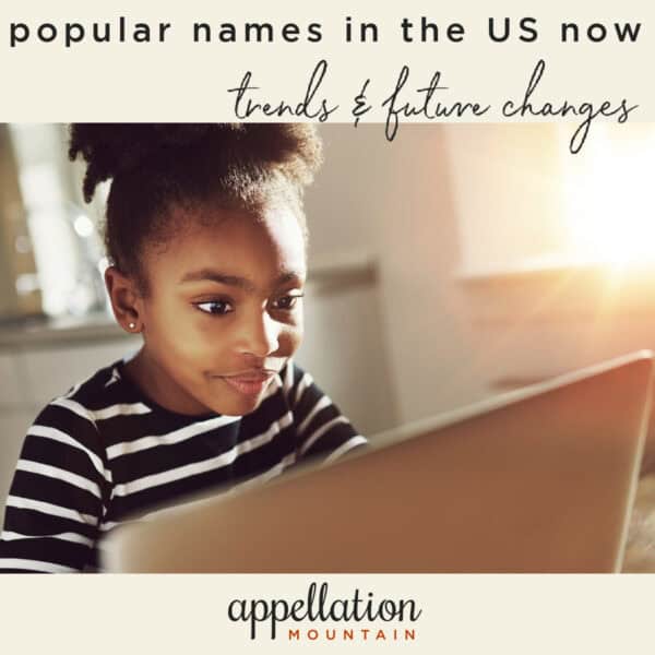 African American girl with her hair up in a bun wearing black and white stripe tee looking at laptop screen; May 2026 baby name data update