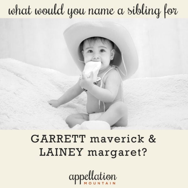 baby with dark hair wearing cowboy hat chewy on soft shoe; Western names like Lainey and Garrett