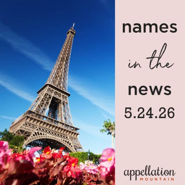 Eiffel Tower at an angle with pink flowers in front; names in the news 5.24.26
