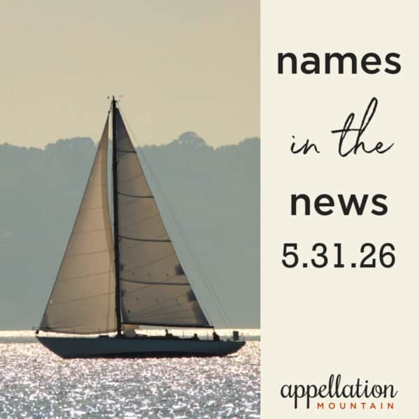 sailboat on calm water with faded trees and sky behind; names in the news 5.31.26