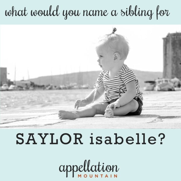 baby girl with blonde hair wearing striped shirt sitting on dock by water; names like Saylor