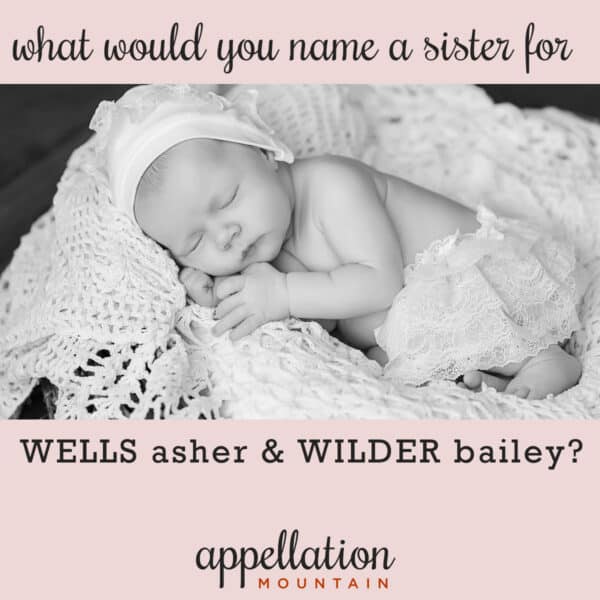 sleeping baby girl wearing white hat on blanket in basket; sister for Wells and Wilder