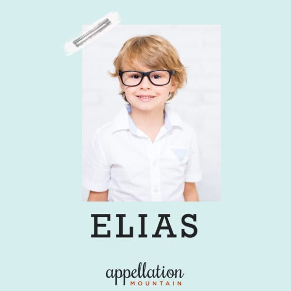 blonde boy child in white button-up shirt with black glasses; baby name Elias