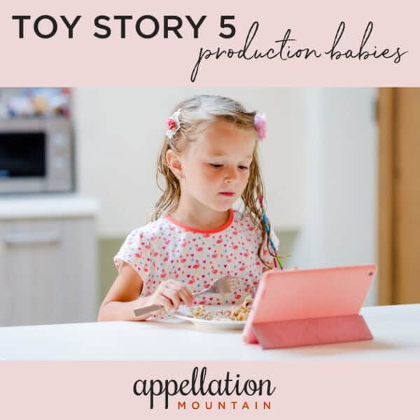 blonde girl child looking at tablet; Toy Story 5 production babies