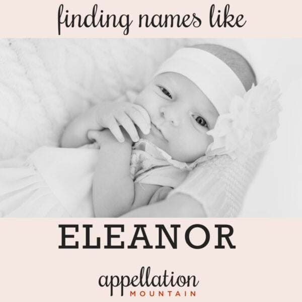baby girl wearing floral headband with hands in front of her face; finding names like Eleanor