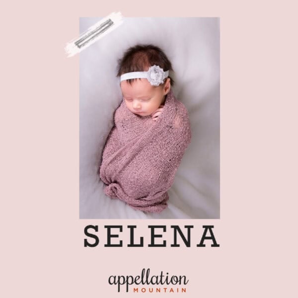 sleeping baby girl with dark hair wearing headband wrapped in pink blanket; baby name Selena