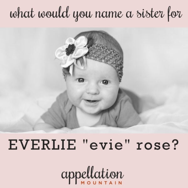 girl baby wearing knit headband with flower, smiling; mismatched names for Everlie's sister