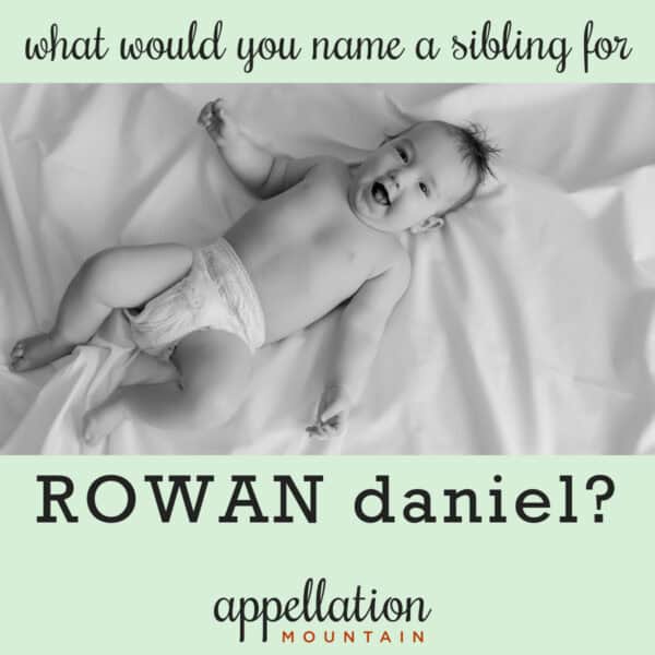 baby wearing diaper lying on sheet; naming Rowan's sibling