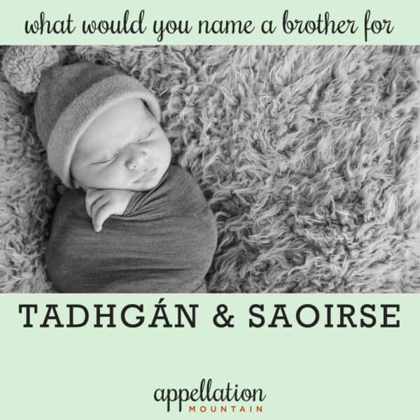 sleeping baby wearing pom pom hat wrapped in blanket on rug; authentic Irish boy names