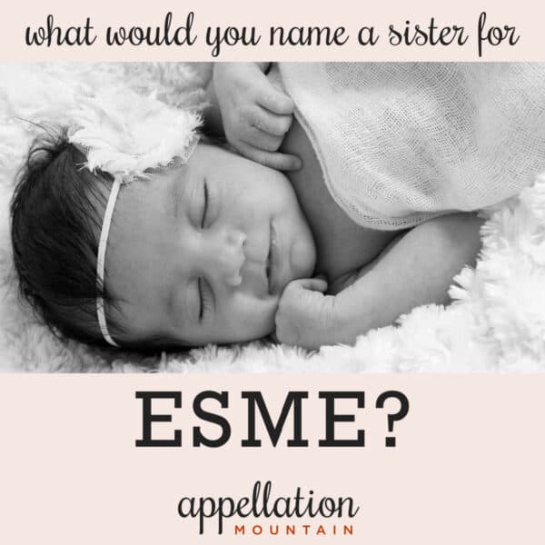 sleeping baby girl with dark hair wearing floral headband and a blanket; naming Esme's sister